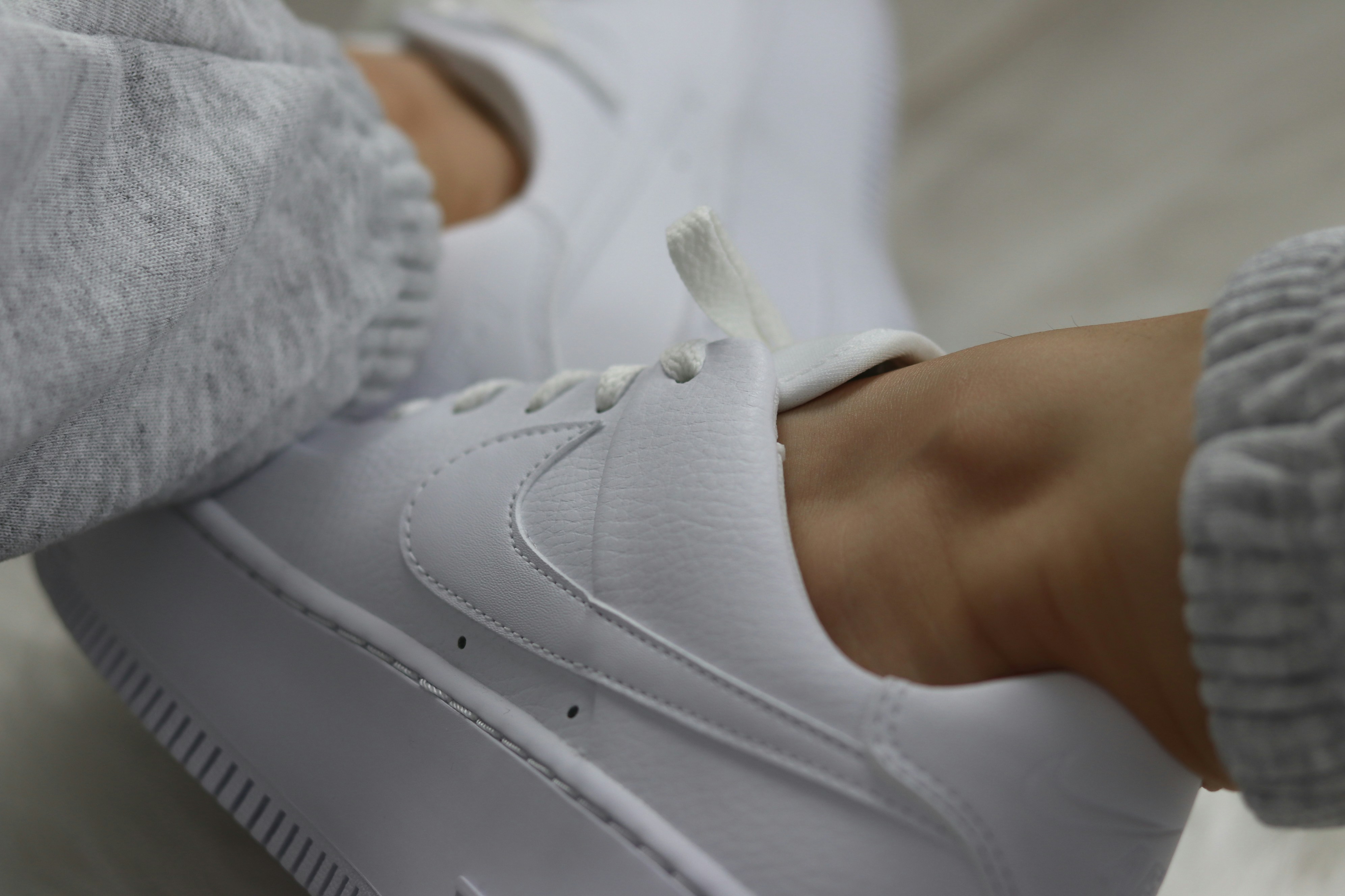 white nike athletic shoes