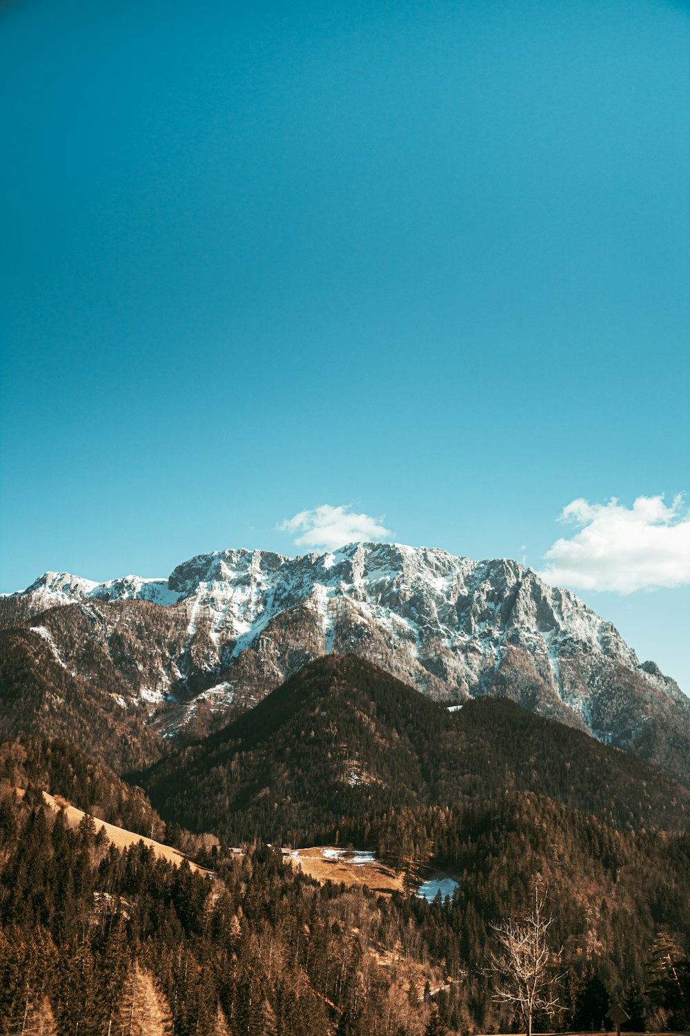 snow covered mountain under blue sky during daytime