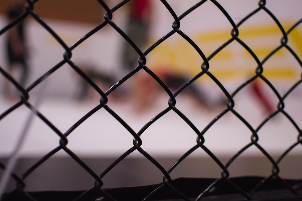 black metal fence with yellow light