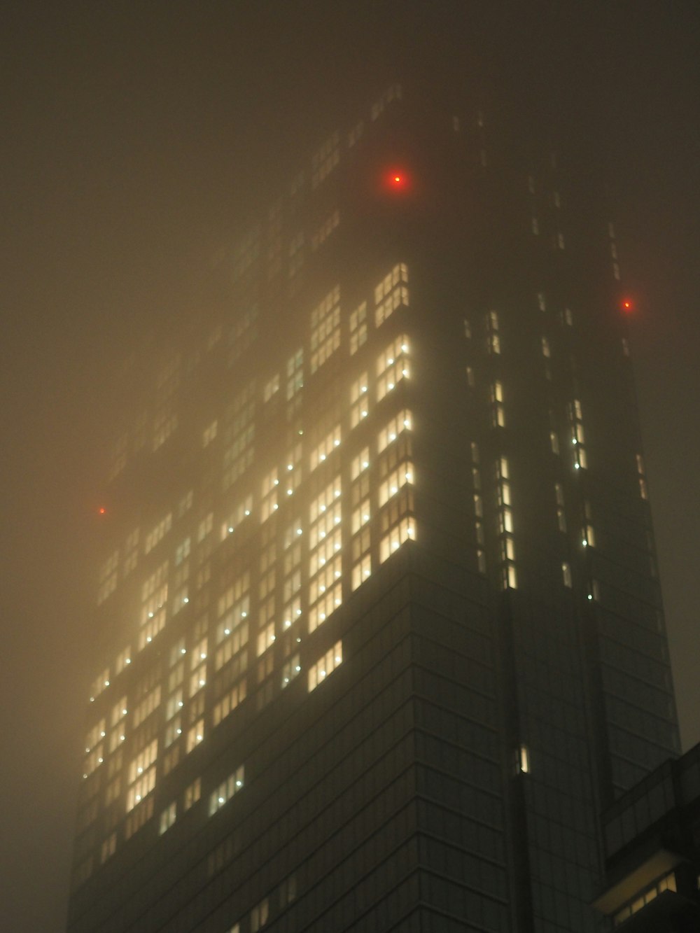 black and white high rise building during night time