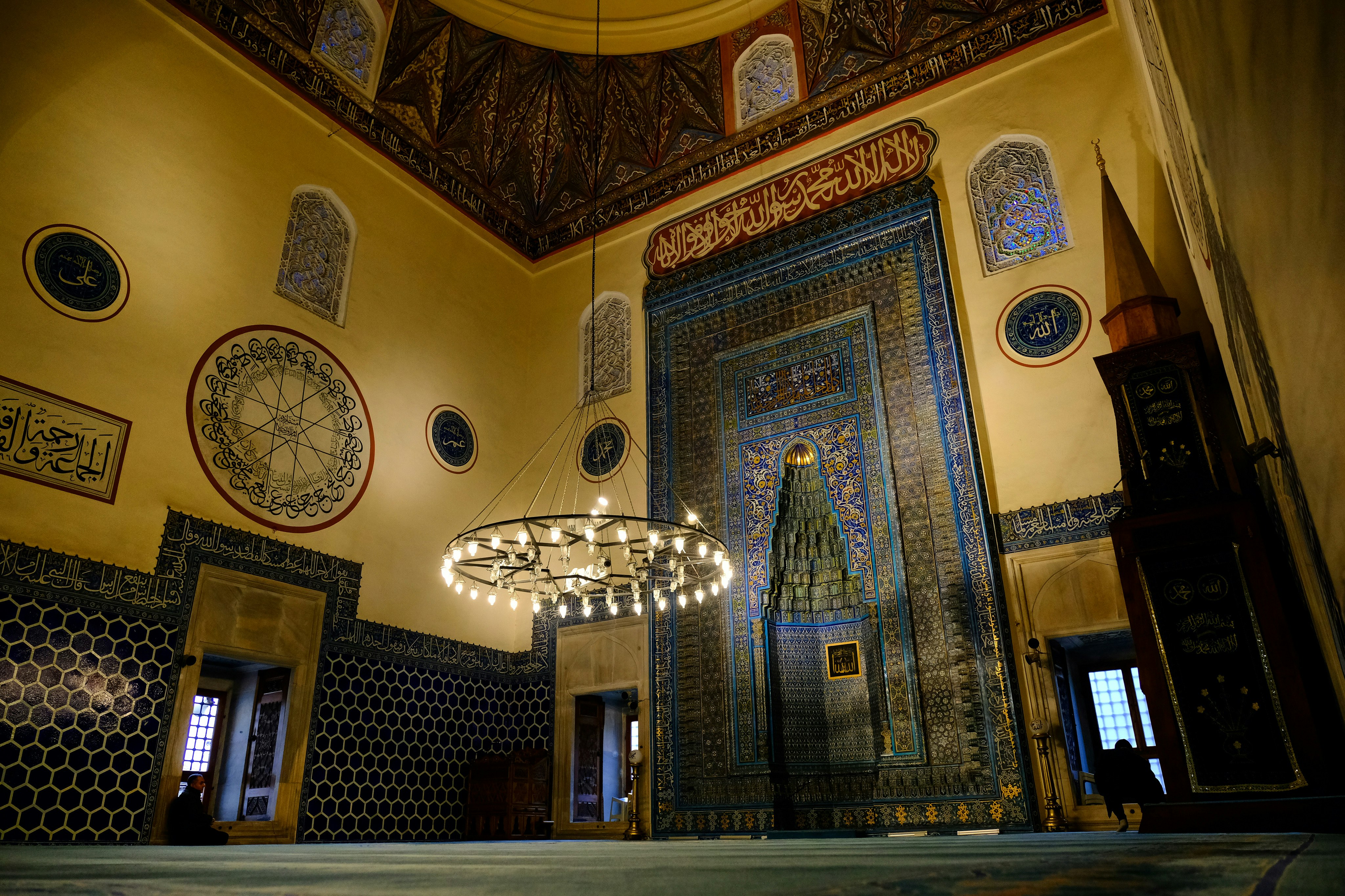 gold and white ceiling with wall clock