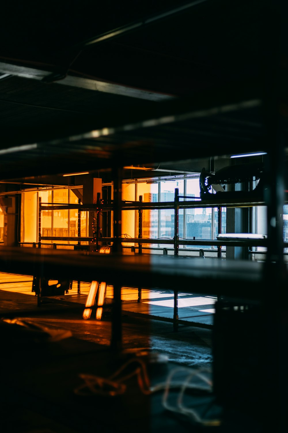 brown wooden bench near glass window