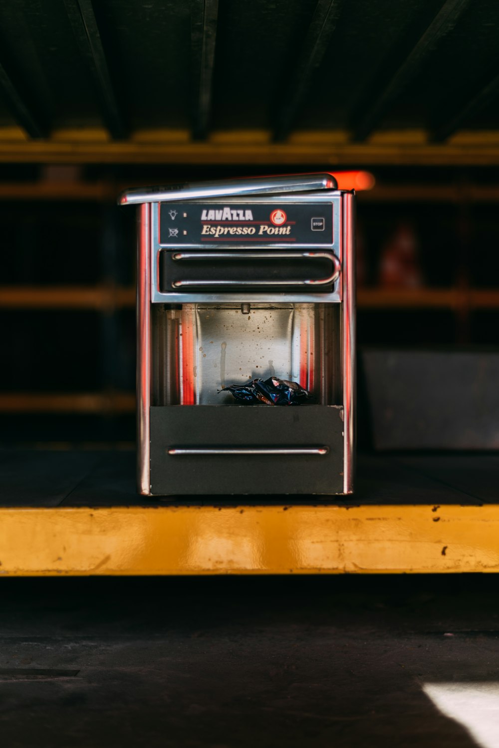 a toaster oven sitting on top of a yellow platform