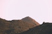 brown rocky mountain under white sky during daytime