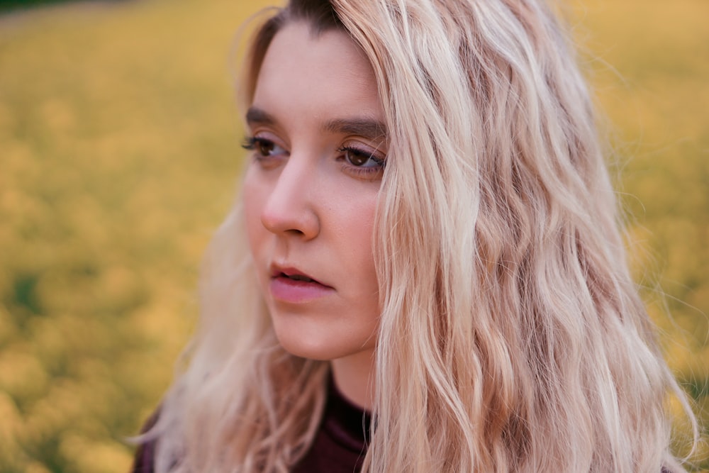 woman in black shirt with blonde hair