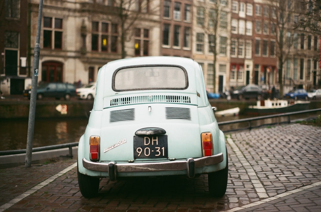 white volkswagen t-2 parked on sidewalk during daytime