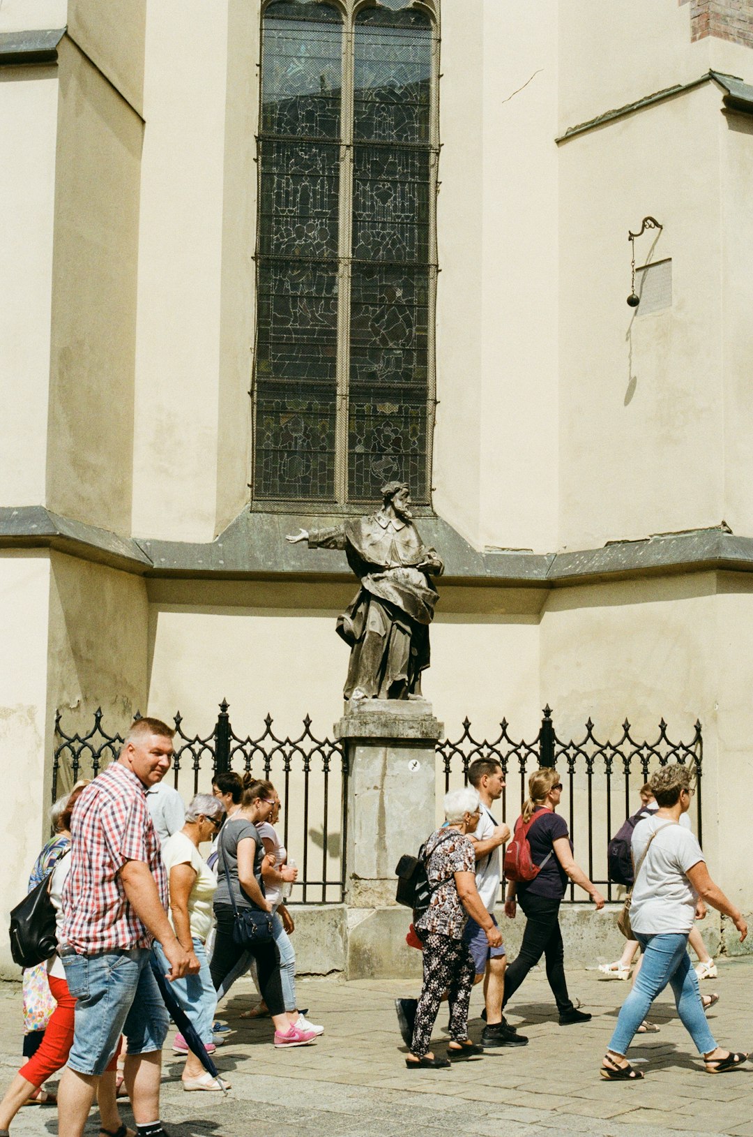 people in front of gray concrete building during daytime