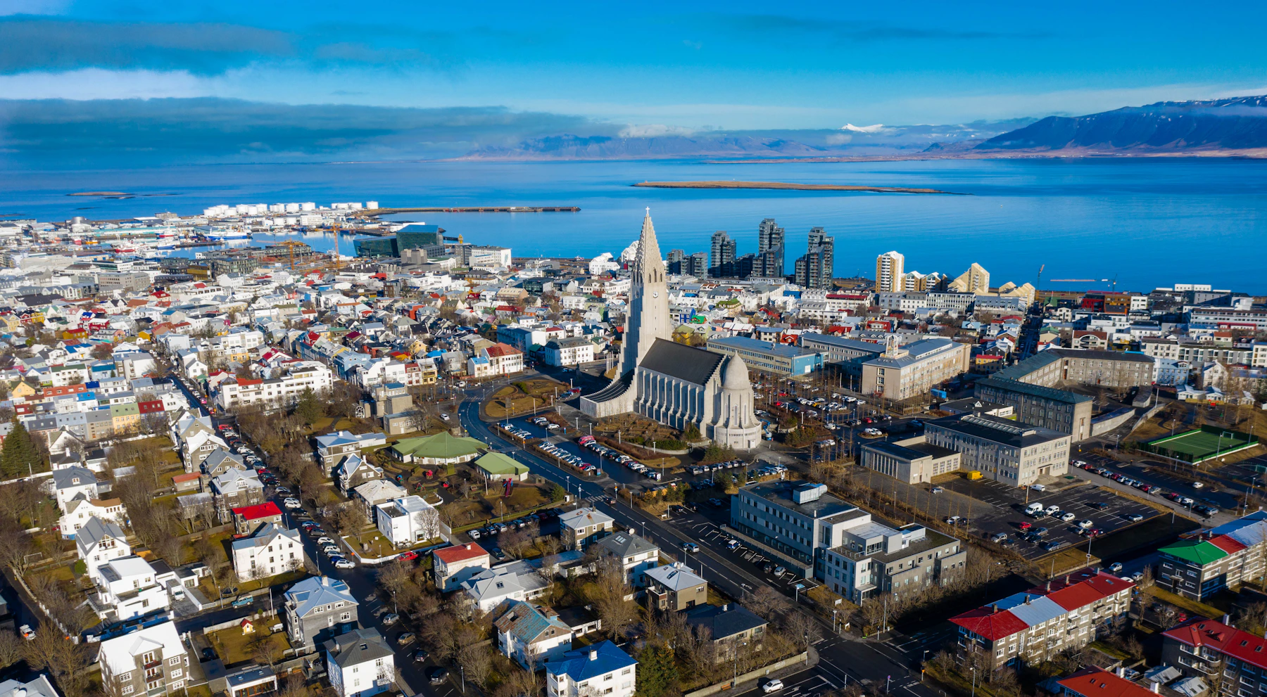 Reykjavík spread between Hallgrímskirkja, the harbour and the blue waters of Faxaflói
