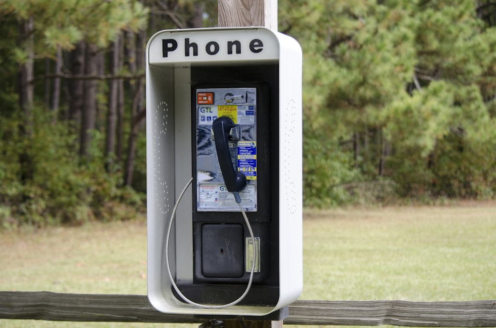 silver and black telephone booth