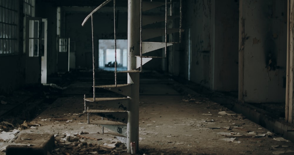 gray metal spiral staircase on gray concrete floor