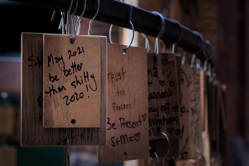 brown wooden board with black and white texts