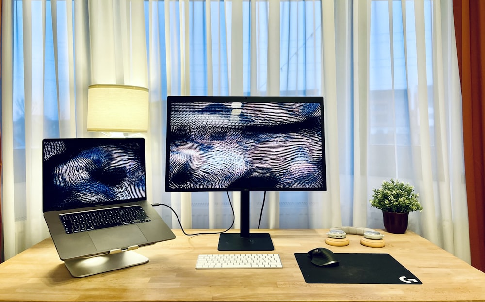 macbook pro on brown wooden table