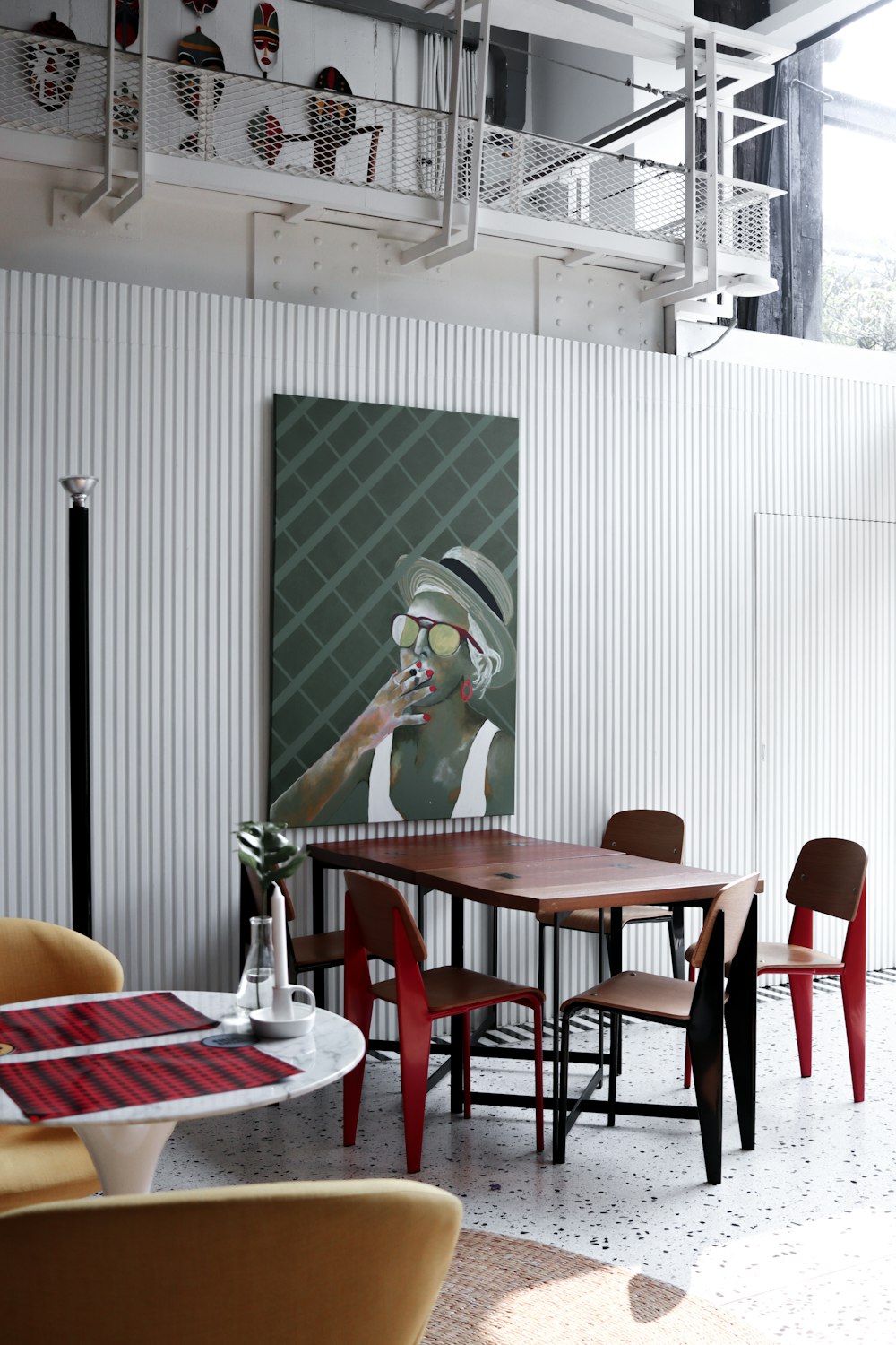 woman in green tank top standing beside dining table