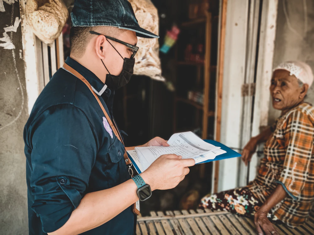 Two people reviewing purchase paperwork