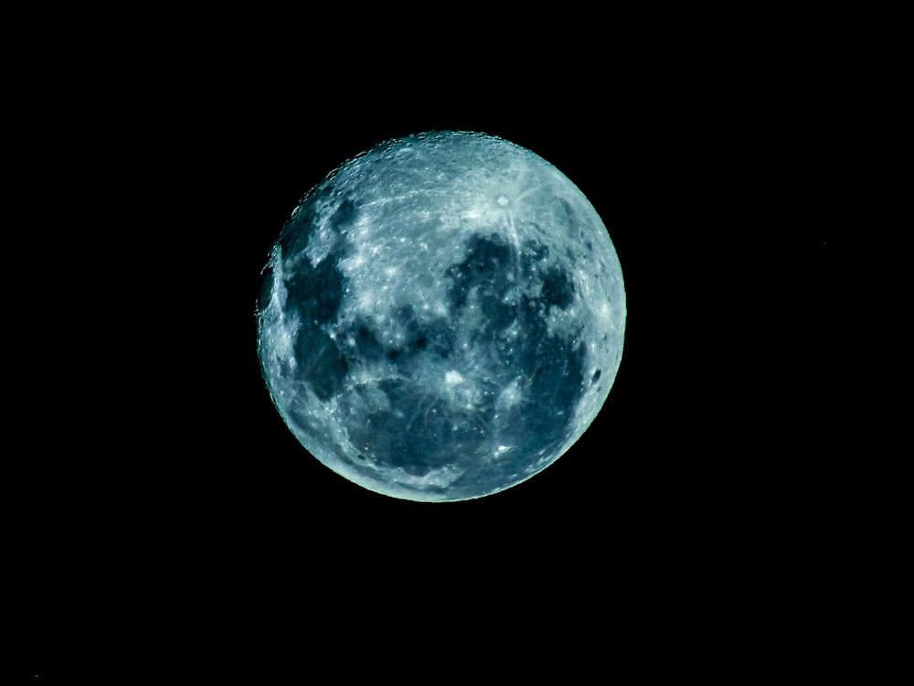 blue moon in dark night sky