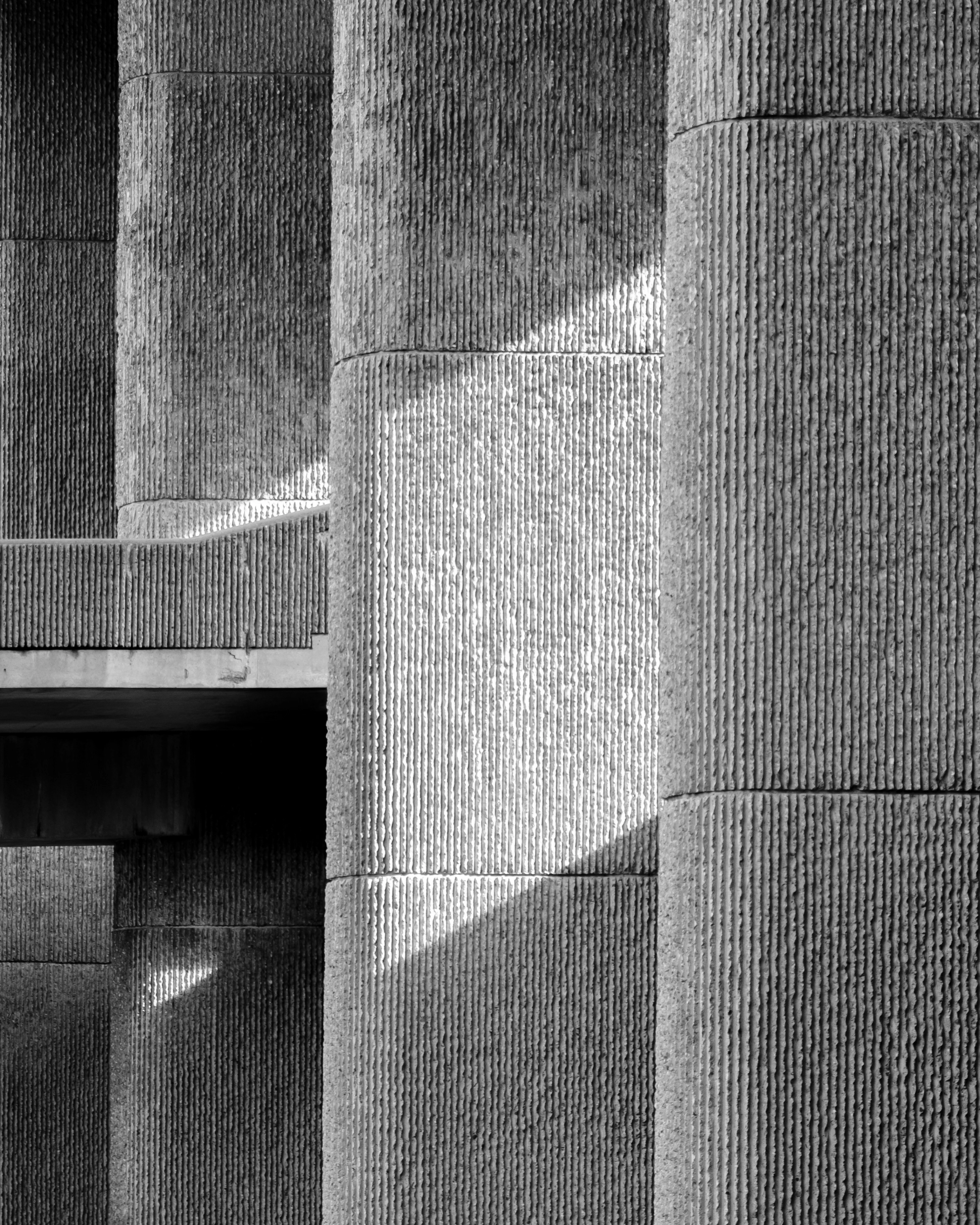 Textured concrete columns in black and white