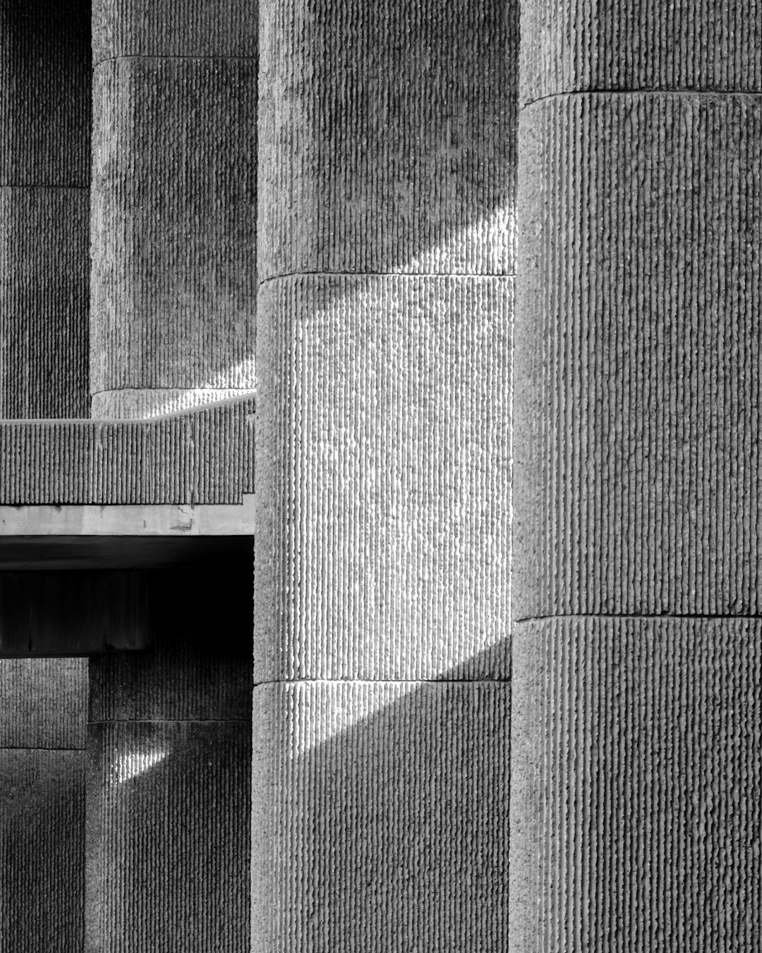 grayscale photo of concrete wall