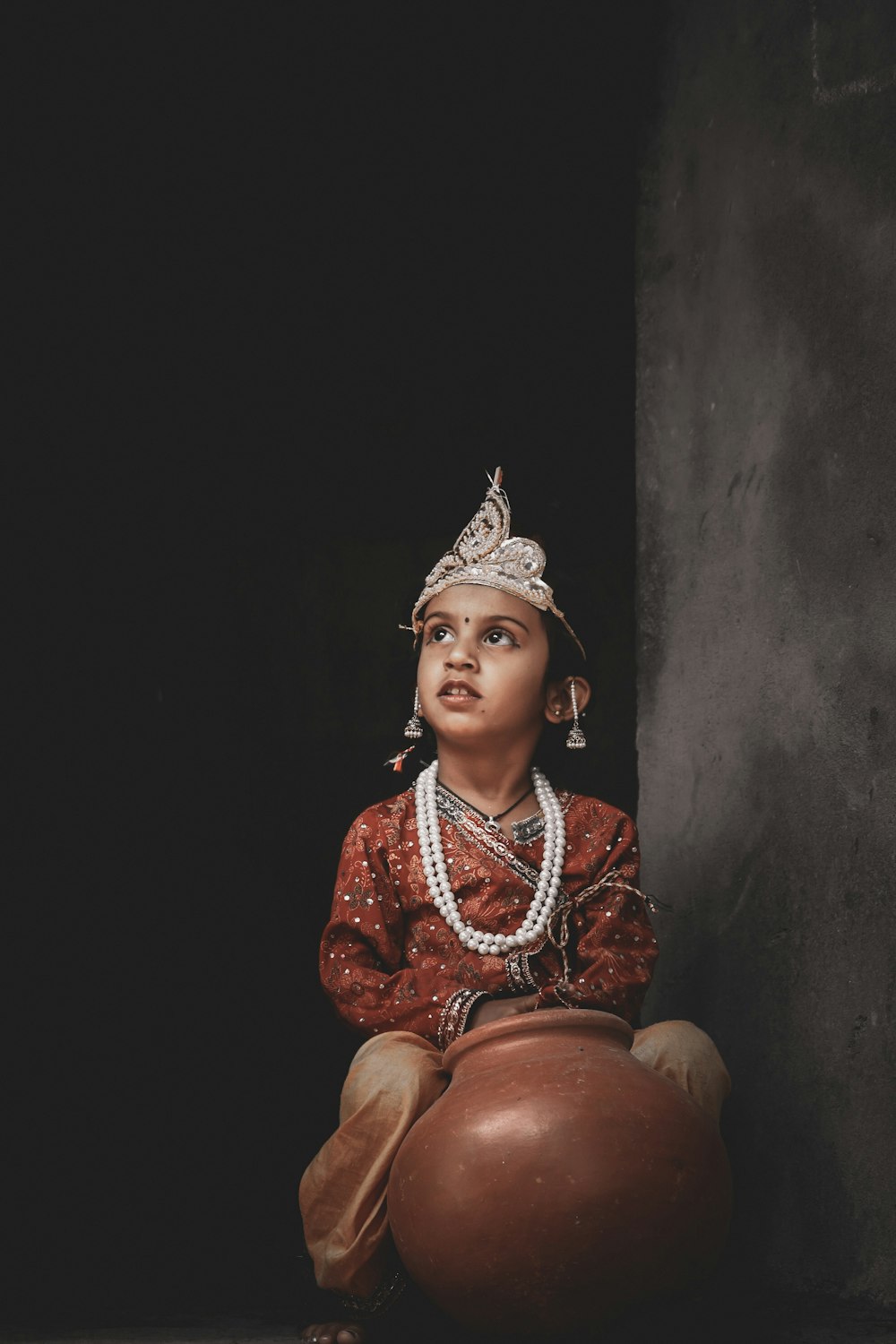 woman in red and gold sari dress