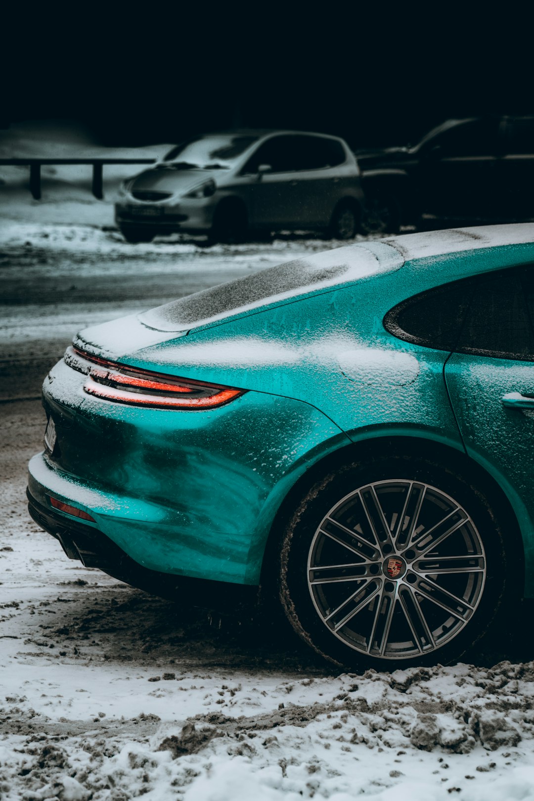 green car on parking lot during daytime