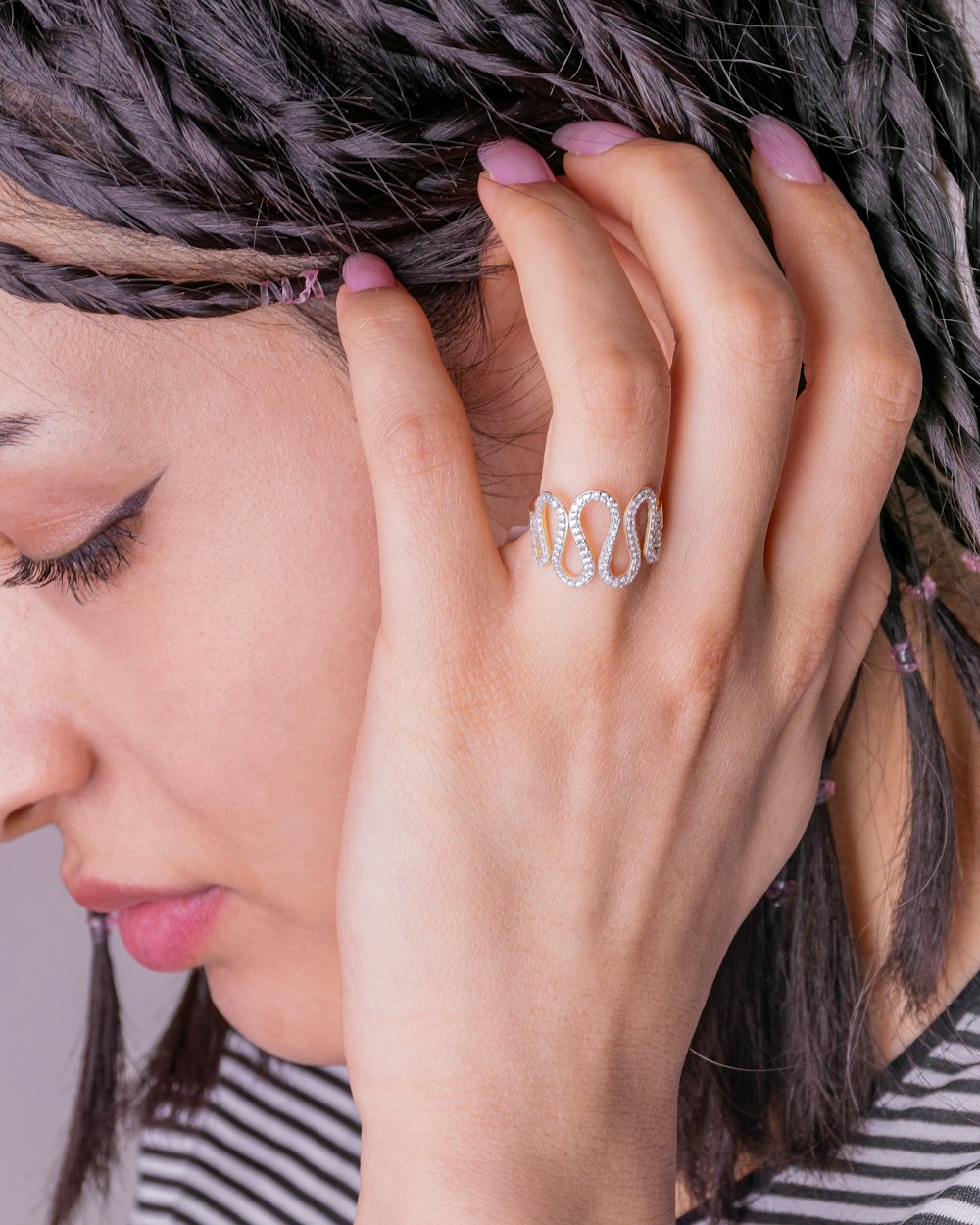 woman wearing gold diamond ring