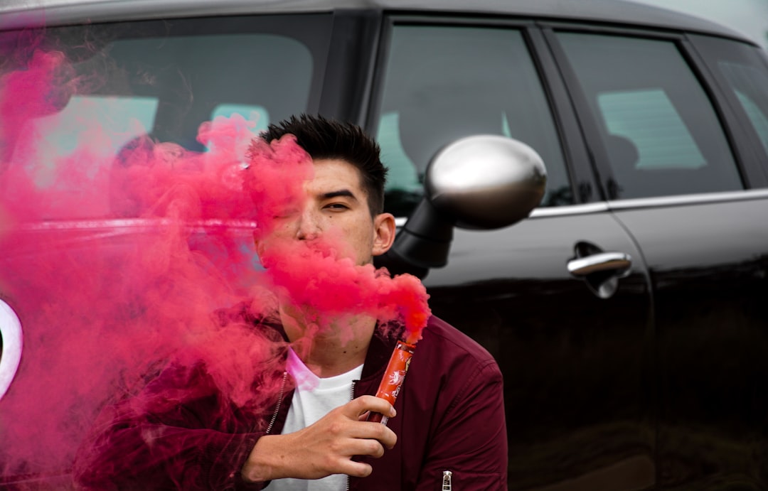 man in black crew neck shirt smoking