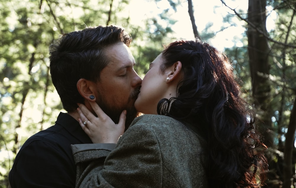 man kissing womans cheek