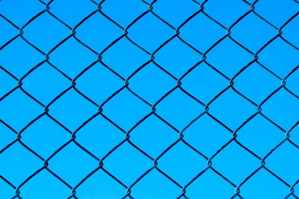 Chain link fence framework along a lot line