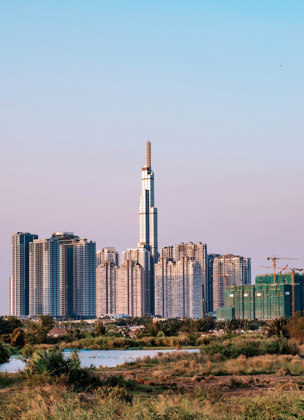 city skyline under blue sky during daytime