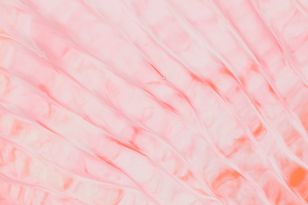 pink and white textile in close up photography