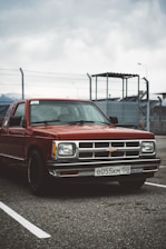 red chevrolet single cab pickup truck