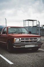 red chevrolet single cab pickup truck