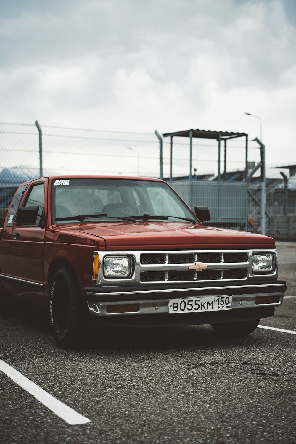 red chevrolet single cab pickup truck