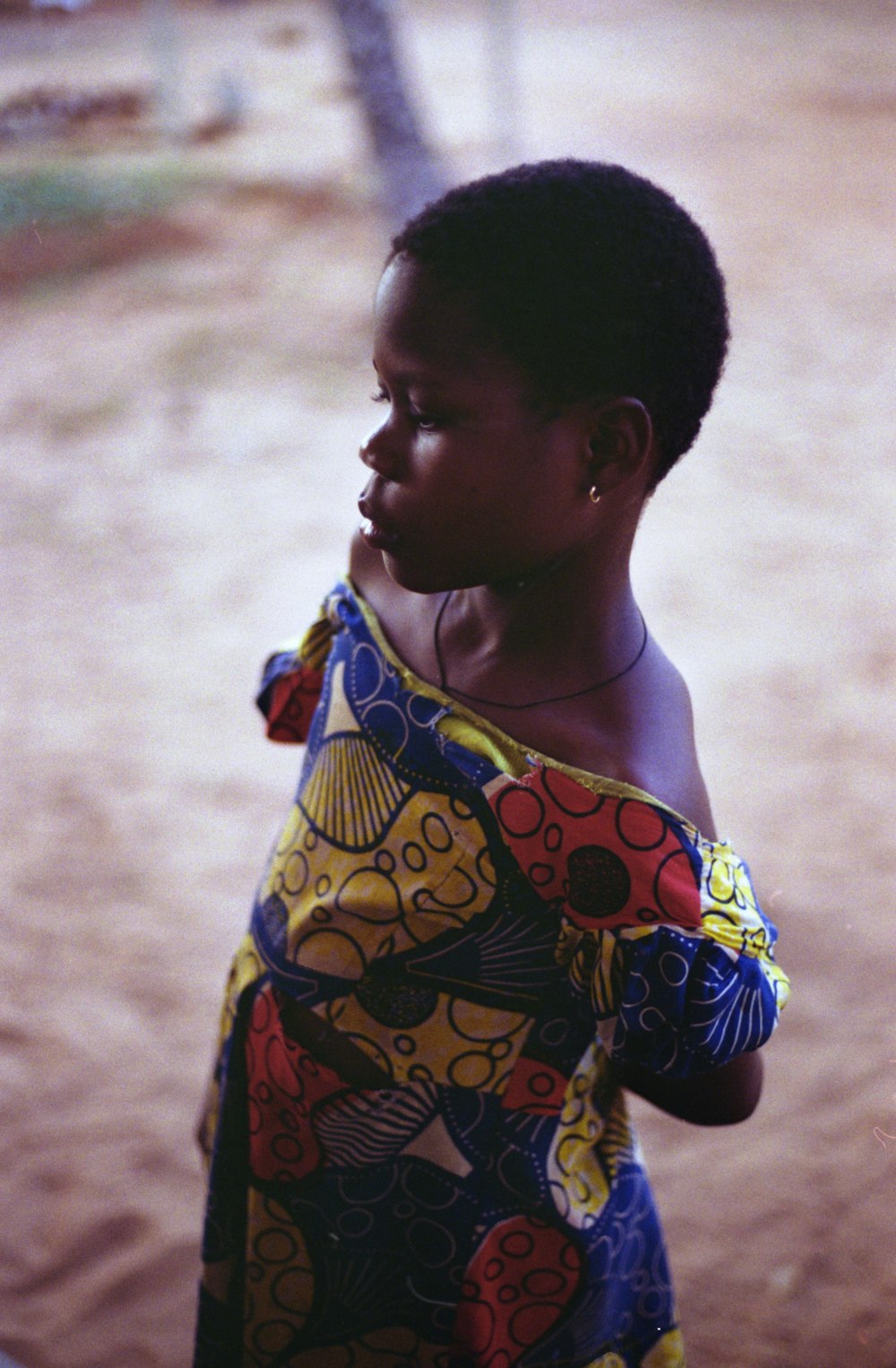 boy in multi color floral shirt