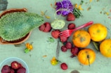 strawberries and green cactus on red plastic container