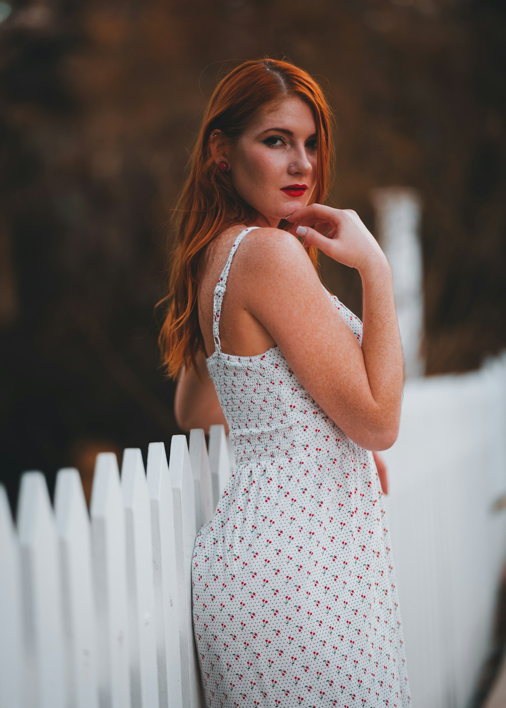 woman in white and black polka dot spaghetti strap dress