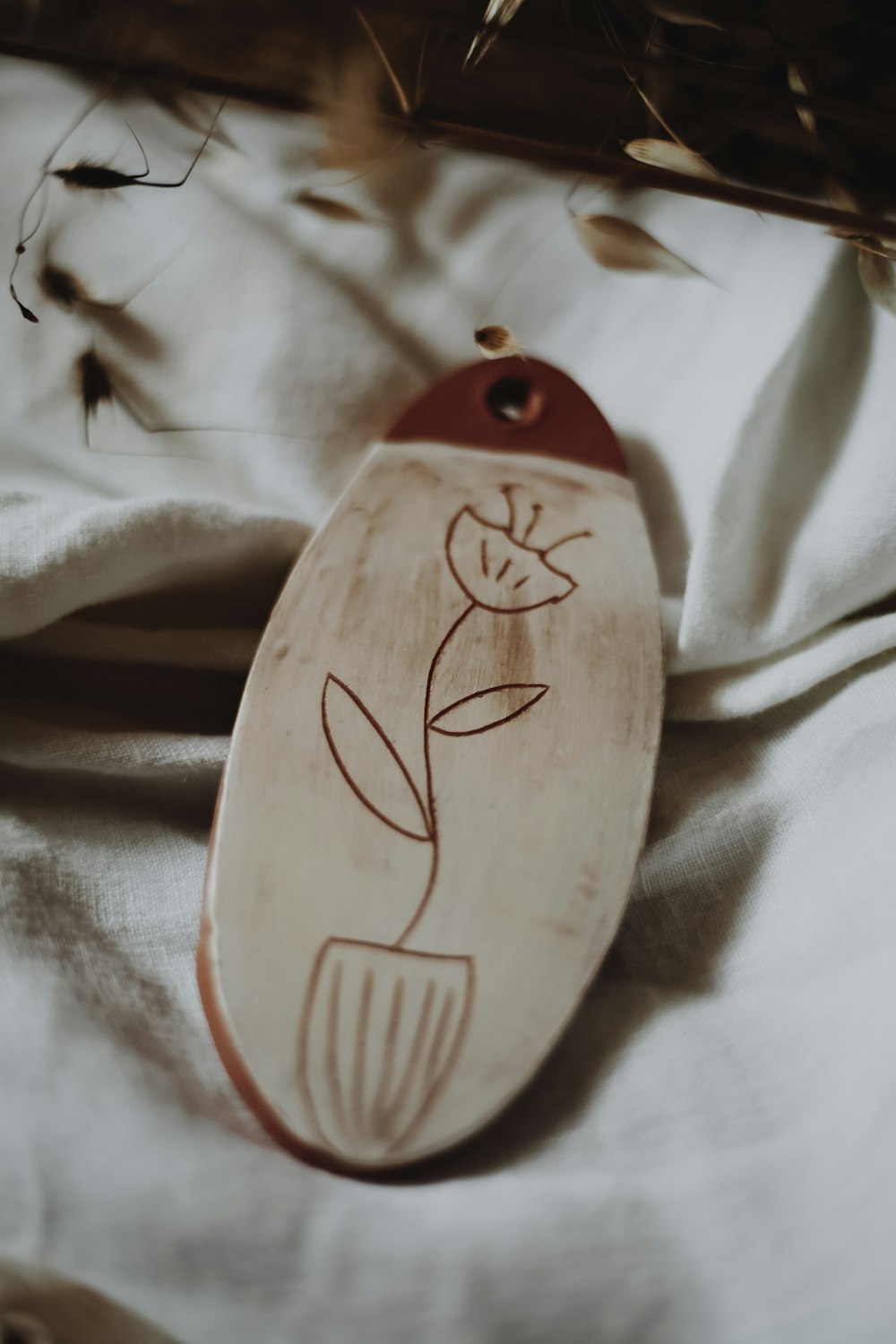 brown and white wooden bird ornament