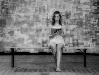A calming image of a woman reading a book on perimenopause.
