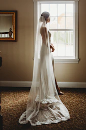 white sheer window curtain on window
