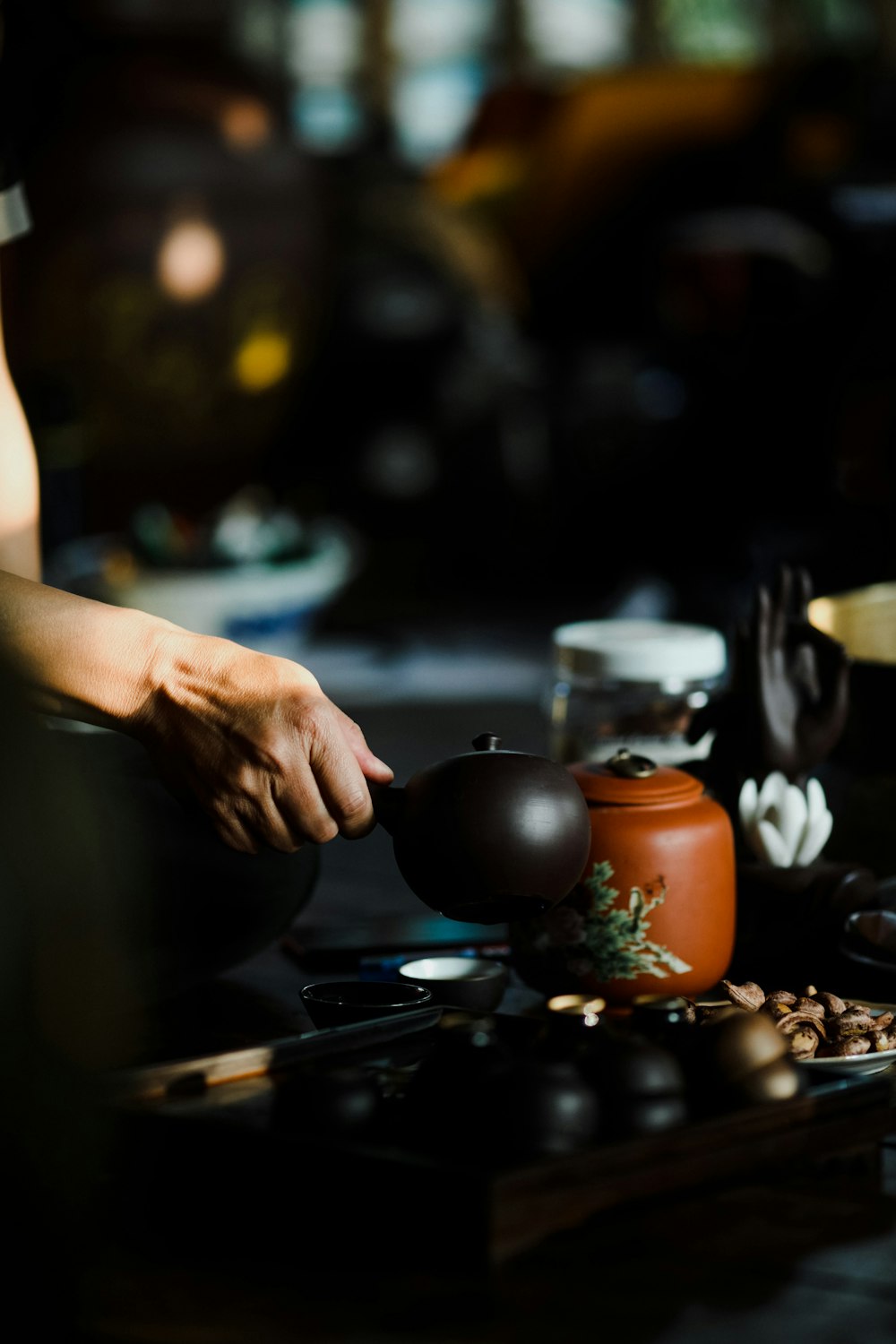 person holding black round ball