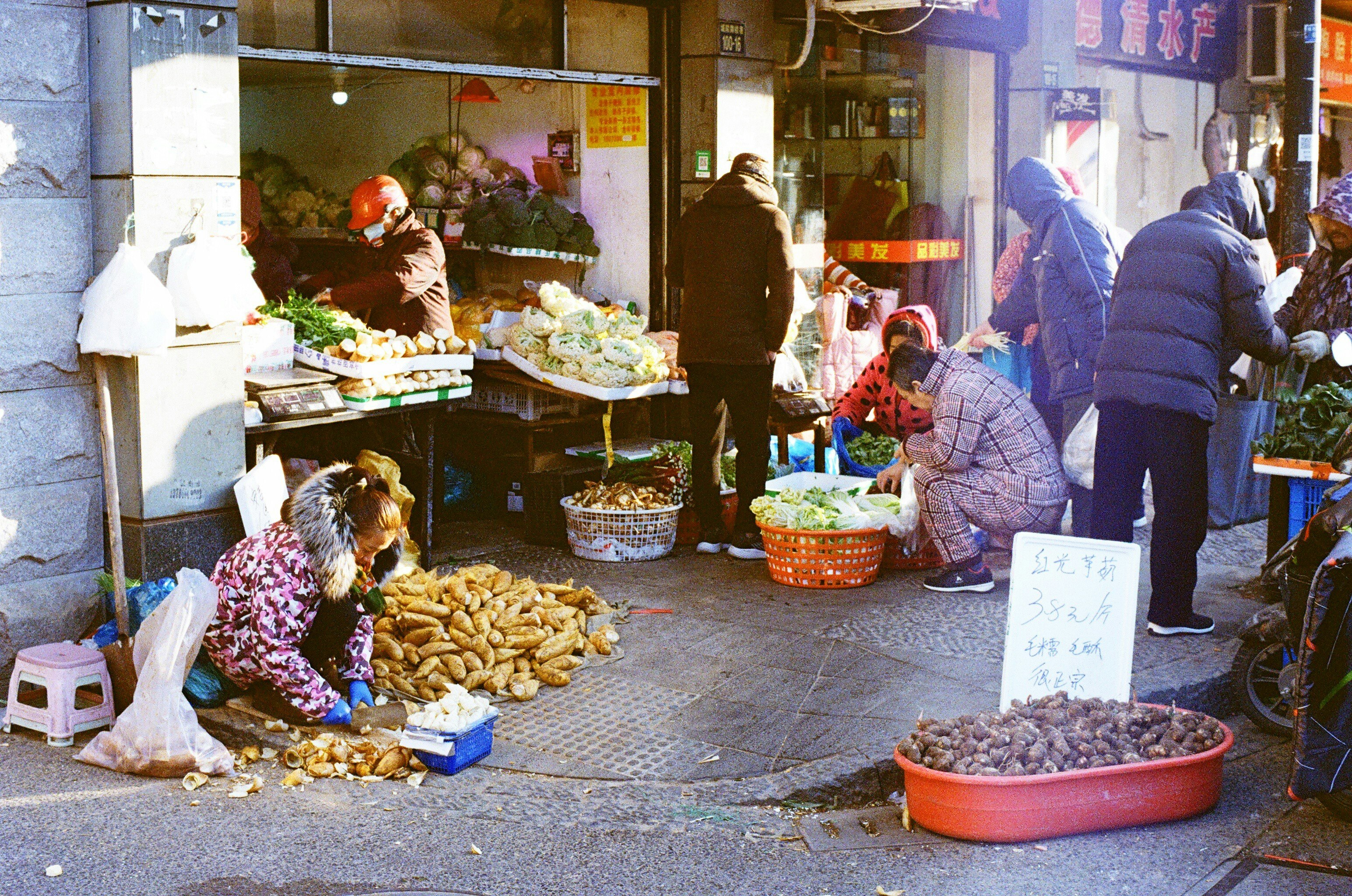 A food market in the streets of Hangzhou. This photo was taken early in the morning, people are getting ready for the day.