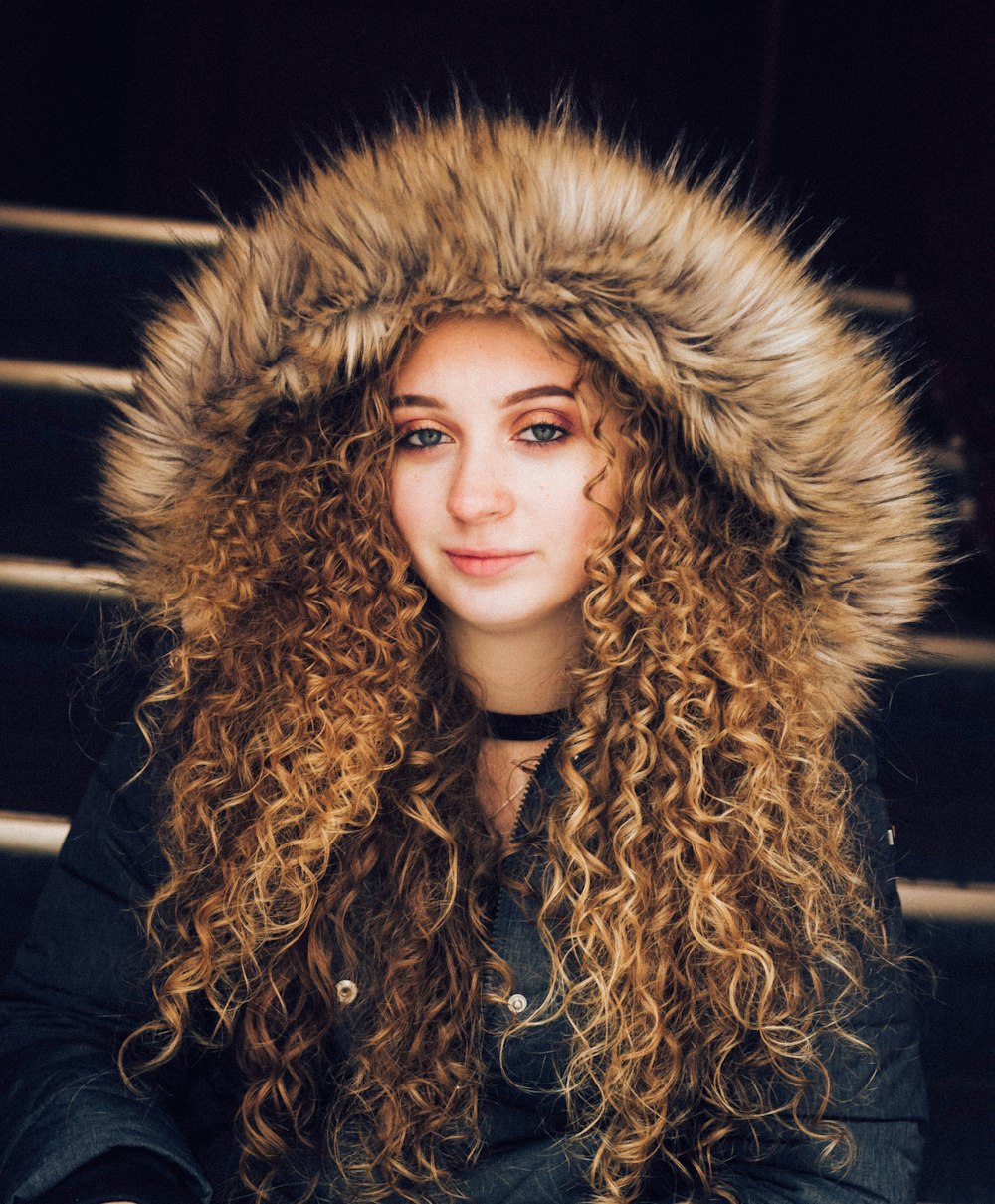 woman in black and brown fur coat