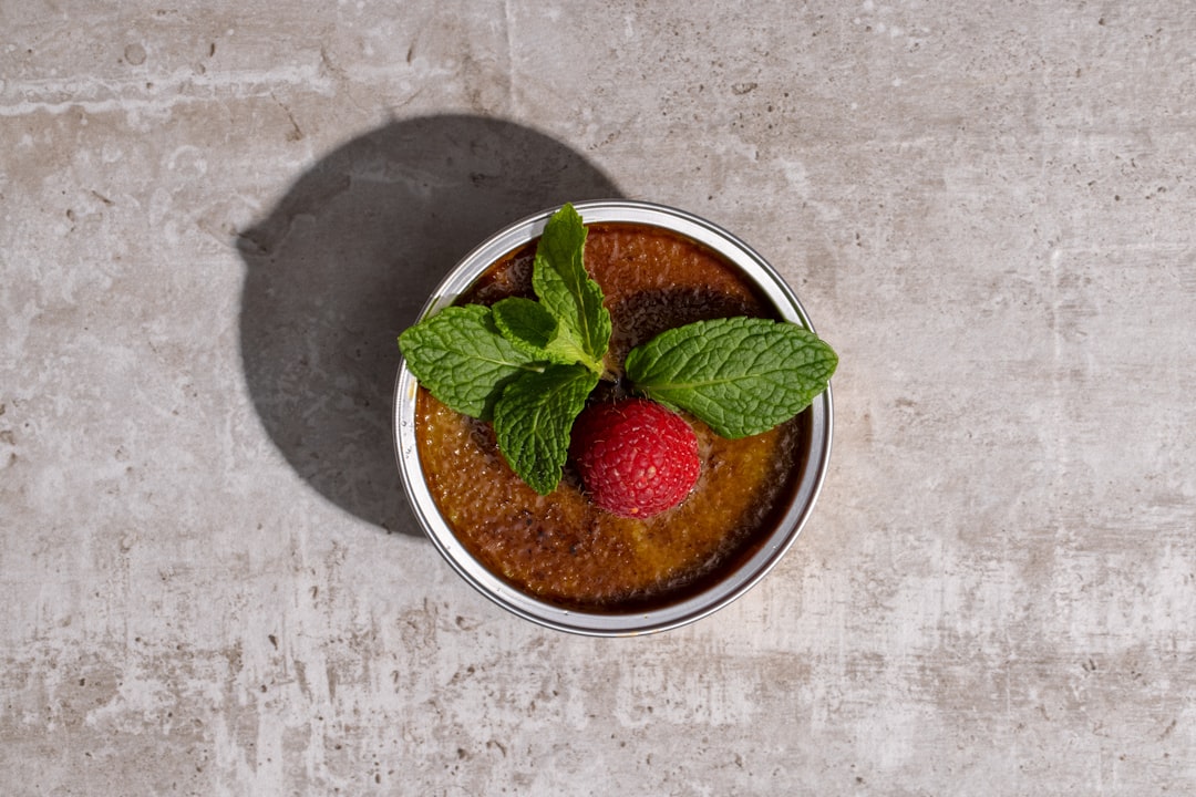 red strawberries in white ceramic bowl