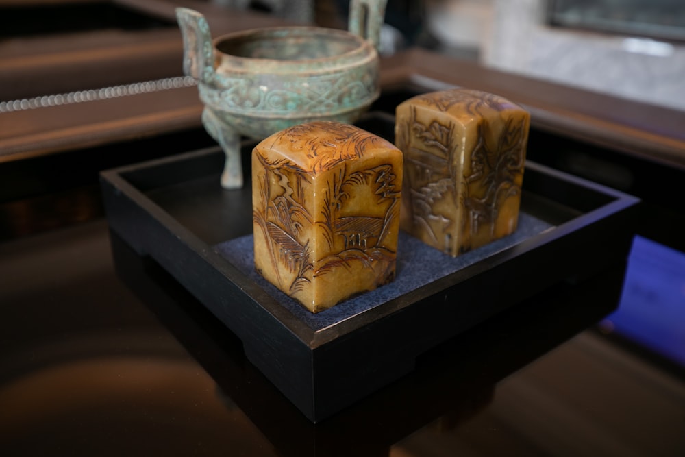 brown wooden container on black wooden table