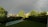 A serene backyard scene features a swimming pool surrounded by a neatly cut lawn. Lush green trees and bushes line the area. Above the landscape, a prominent rainbow arcs across a cloudy sky, adding a peaceful and hopeful ambiance to the scene.