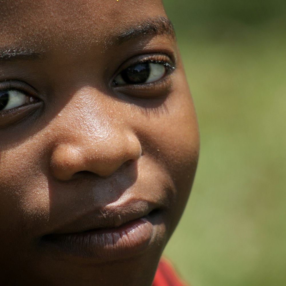 boy in red shirt smiling