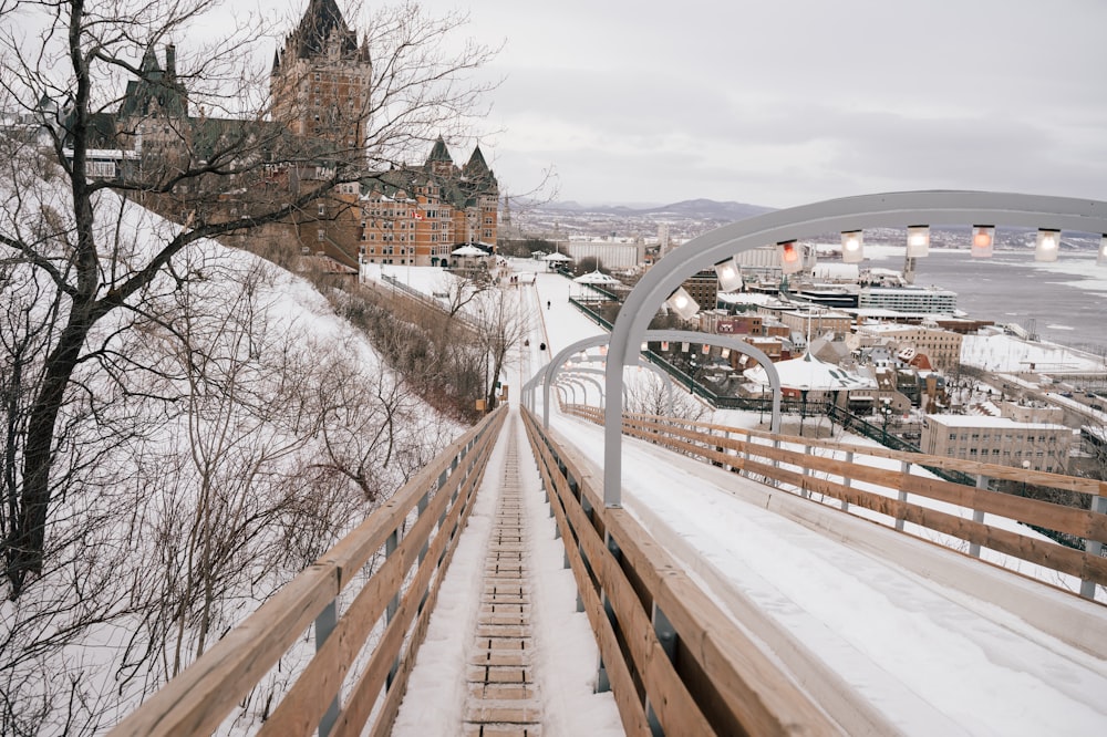 brown wooden bridge over river during daytime