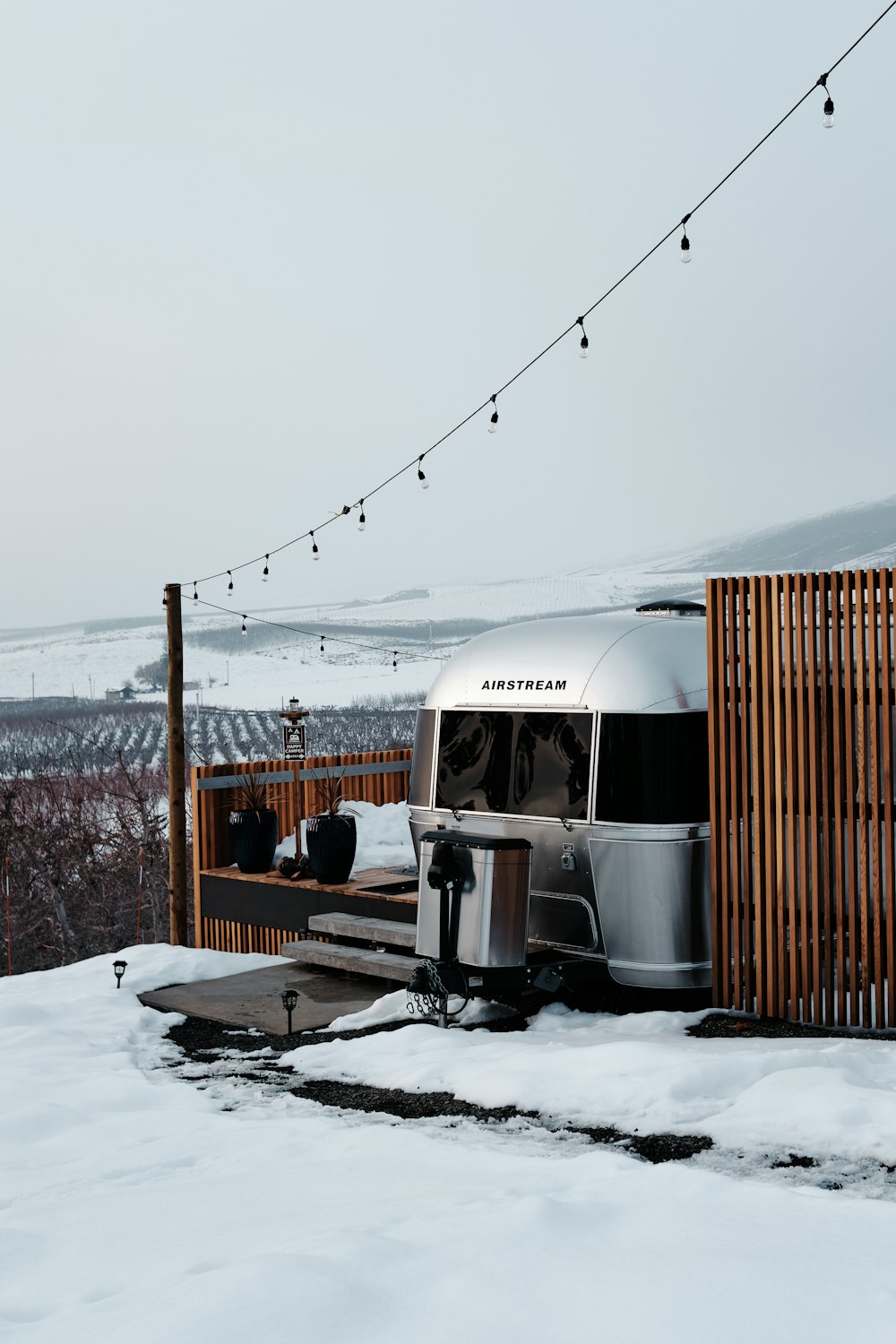 white and brown train on snow covered ground during daytime