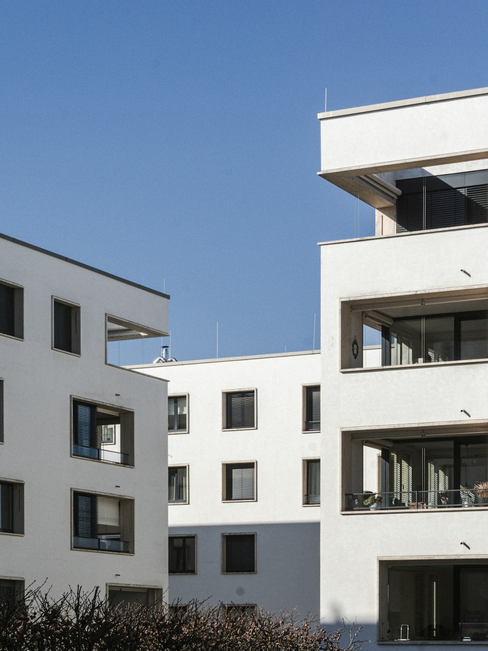 white concrete building under blue sky during daytime