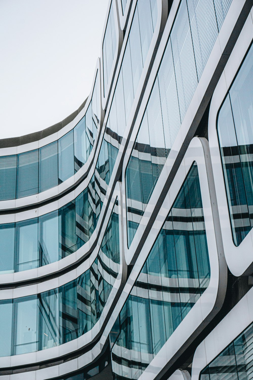 white and blue glass walled building