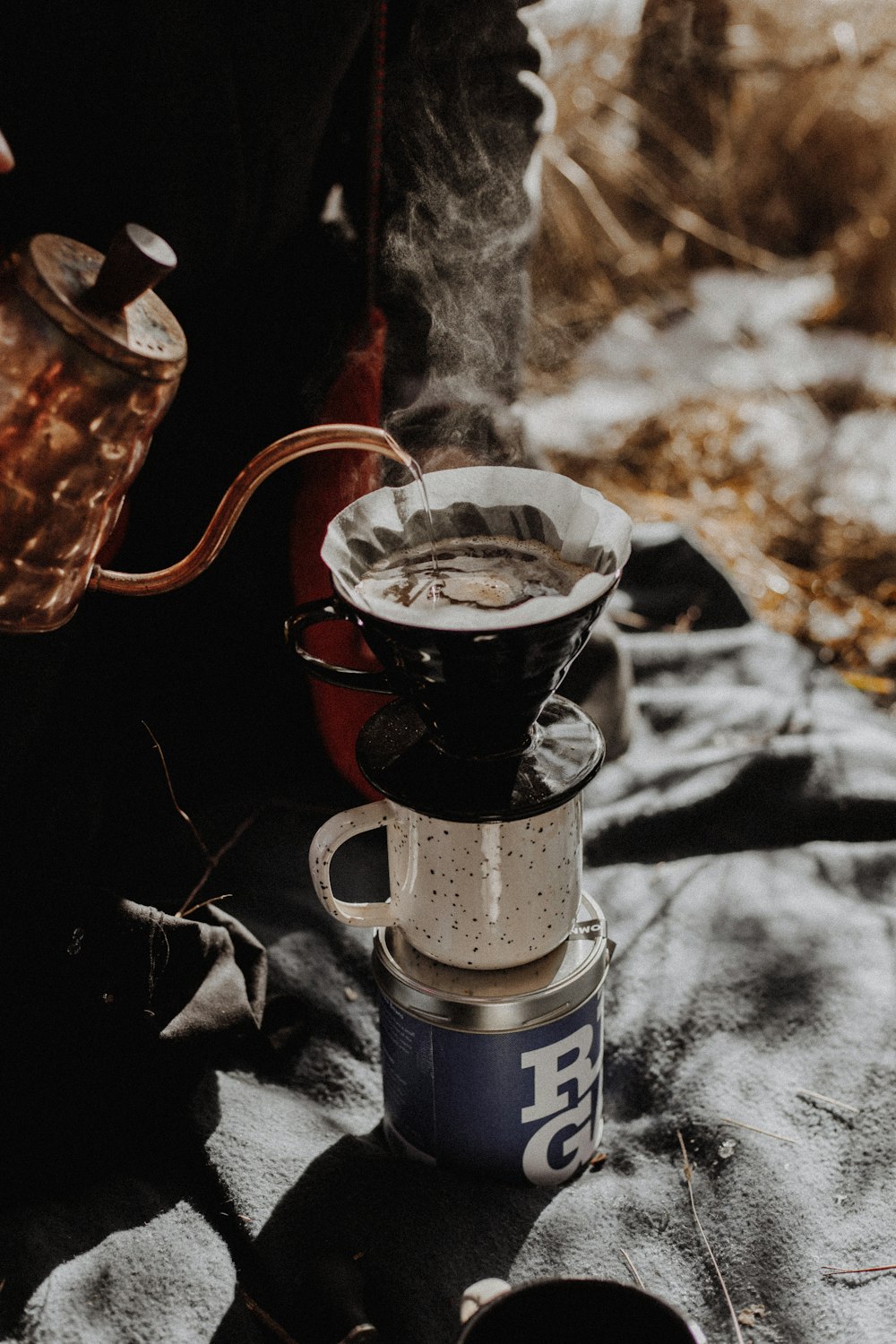 Process of making camping coffee outdoor Stock Photo by bondarillia